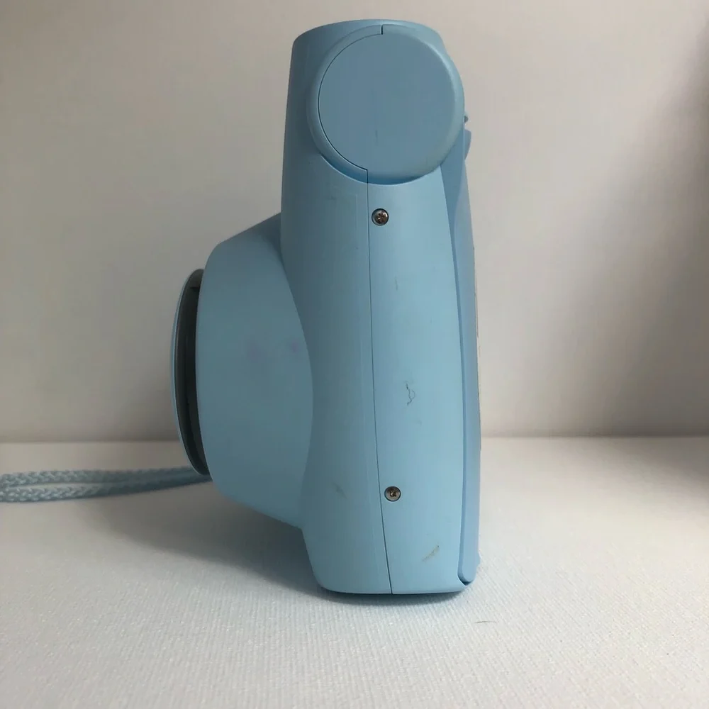 Blue instax mini 7s Polaroid camera