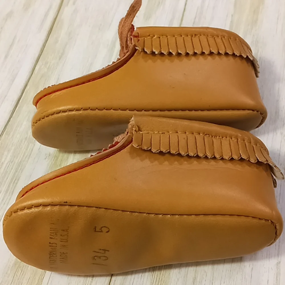 Minnetonka moccasins man worn