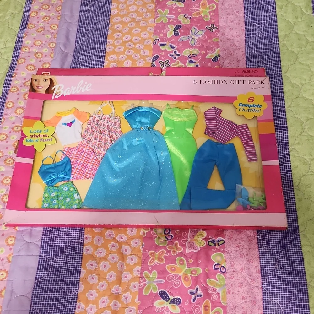 Brand New never opened Barbie fashions.