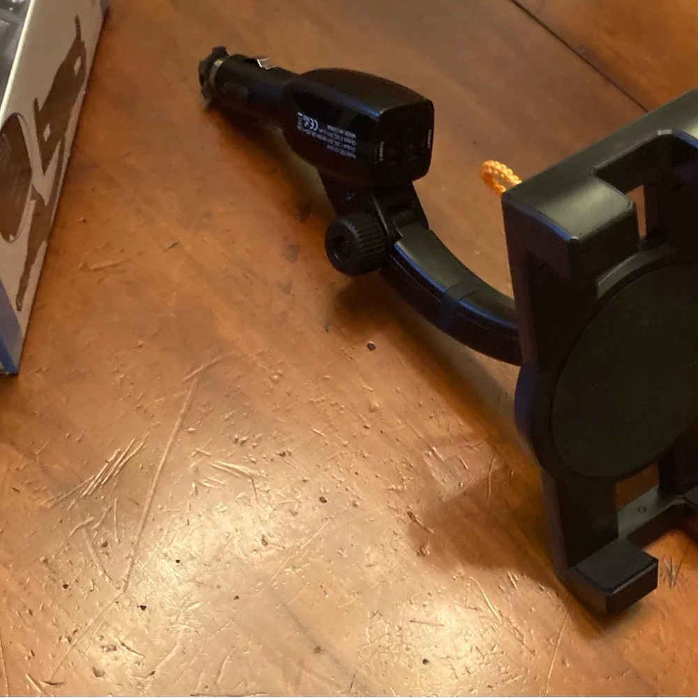 Car charging holder for tablet or phone, 2 usb ports, straps to hold device