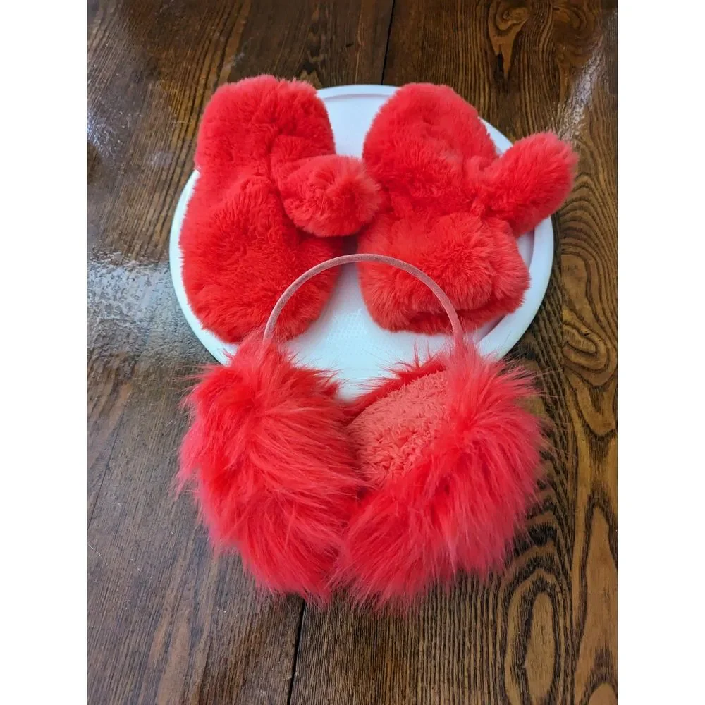 Girls red fluffy mittens and earmuffs