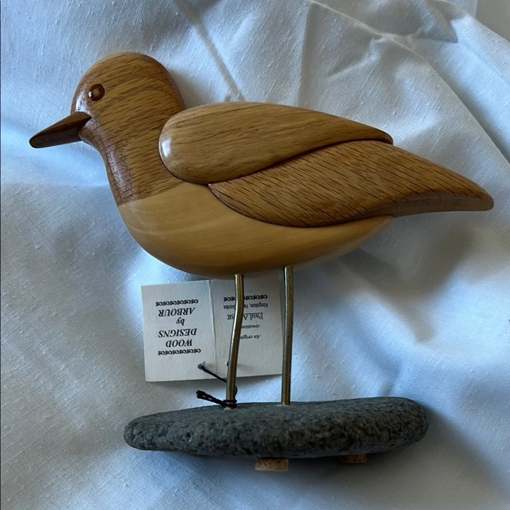 Light Brown Wooden Bird Toy with Detailed Carving and Metal Legs