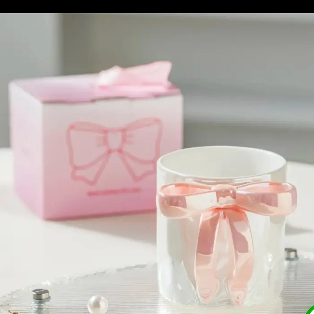 RIBBON HANDLE CUP NEW IN BEAUTIFUL PACKAGE. NIB PINK WHITE AND PURPLE AVAIL