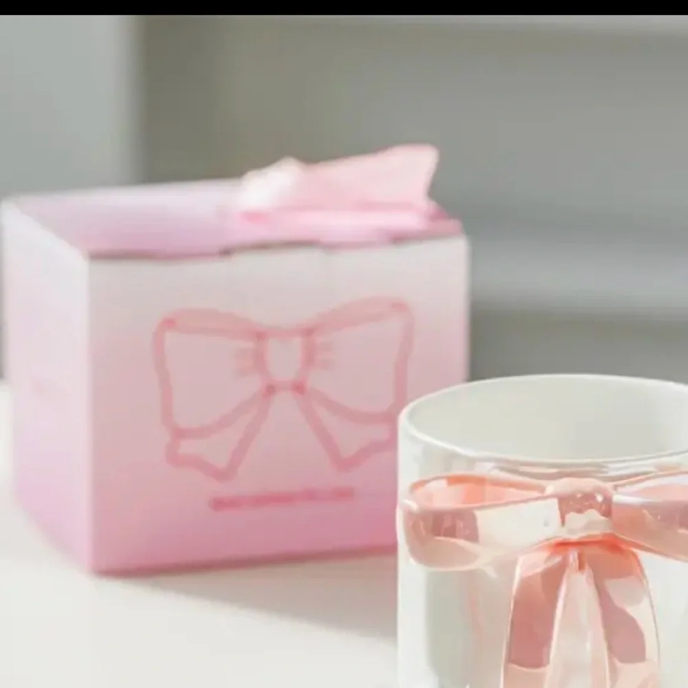 RIBBON HANDLE CUP NEW IN BEAUTIFUL PACKAGE. NIB PINK WHITE AND PURPLE AVAIL