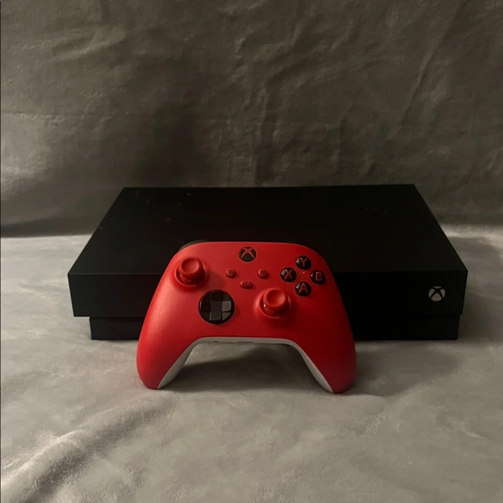 Black Xbox One X with Red Controller