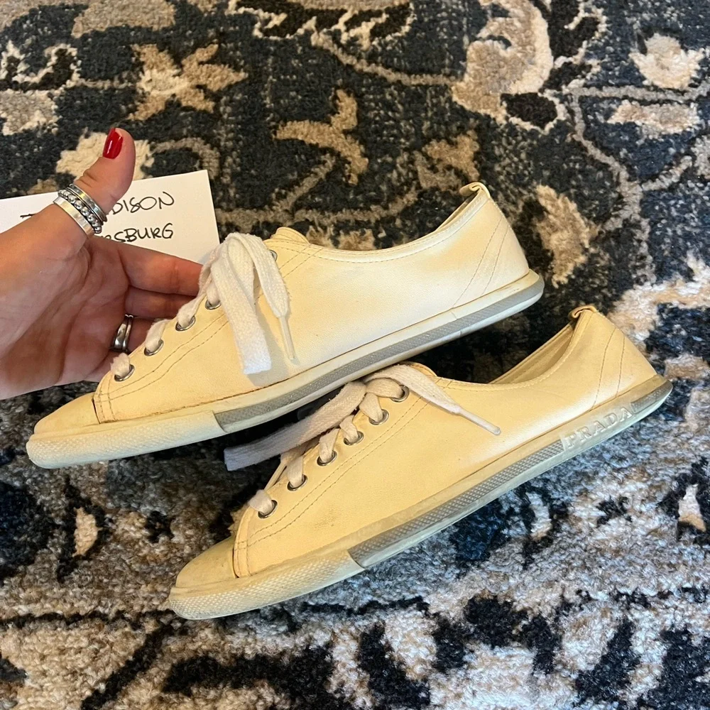 Prada questions leave