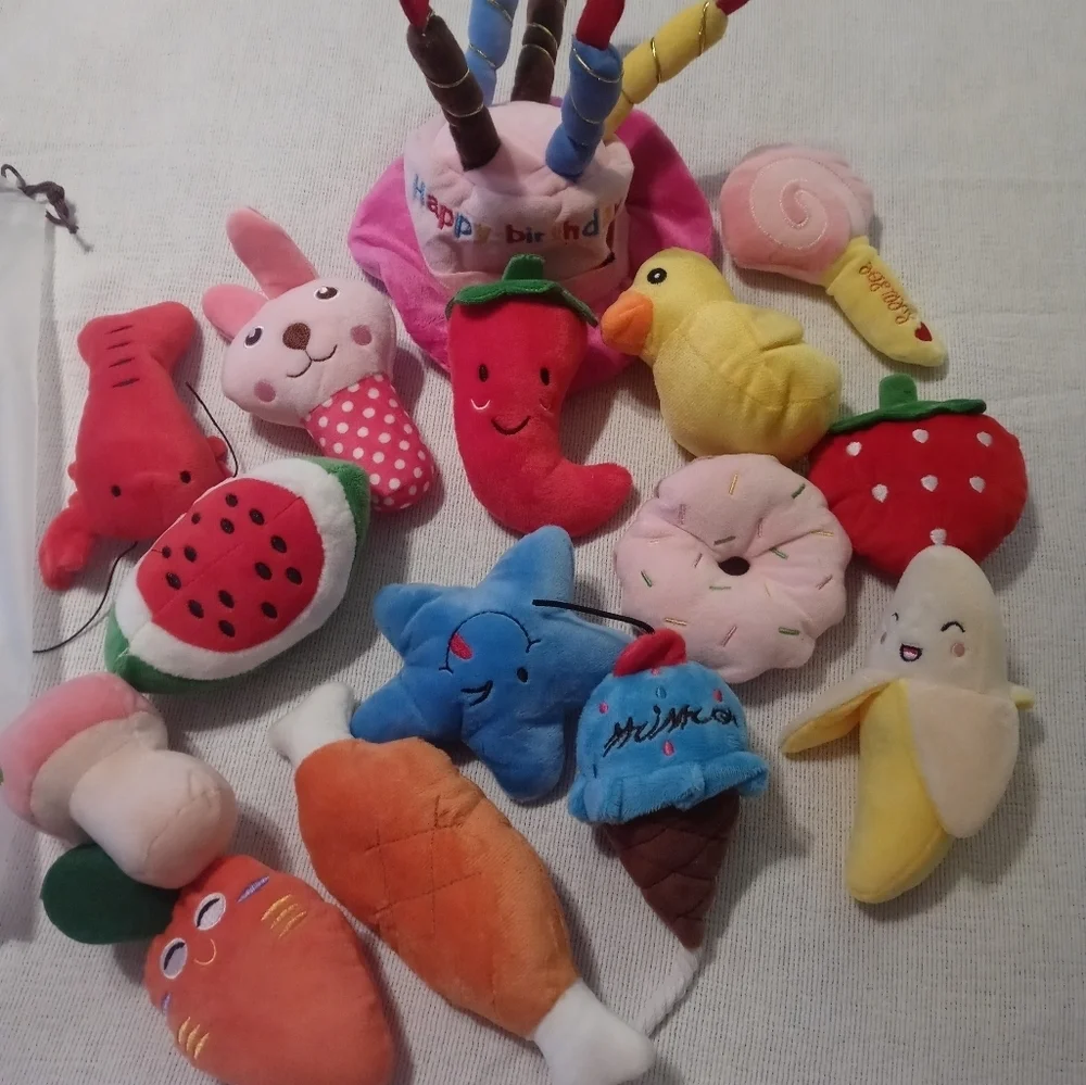 Brand new 12-piece dog/cat sm toys with squeezy noises, comes with colored bows