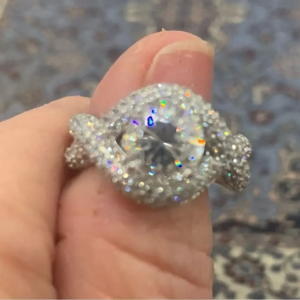 Unique and lovely solitaire style with a wrap effect size 8. CZ and silver