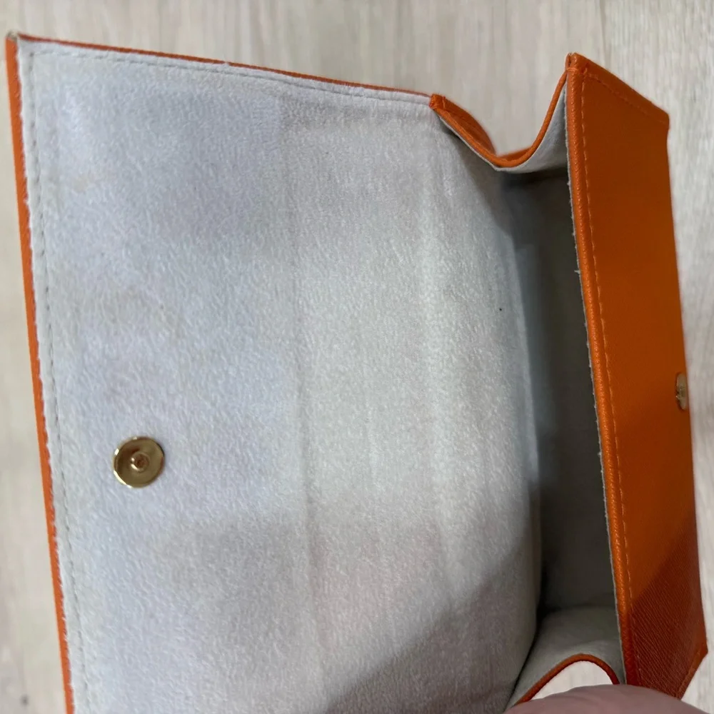 Tory Burch owned case orange