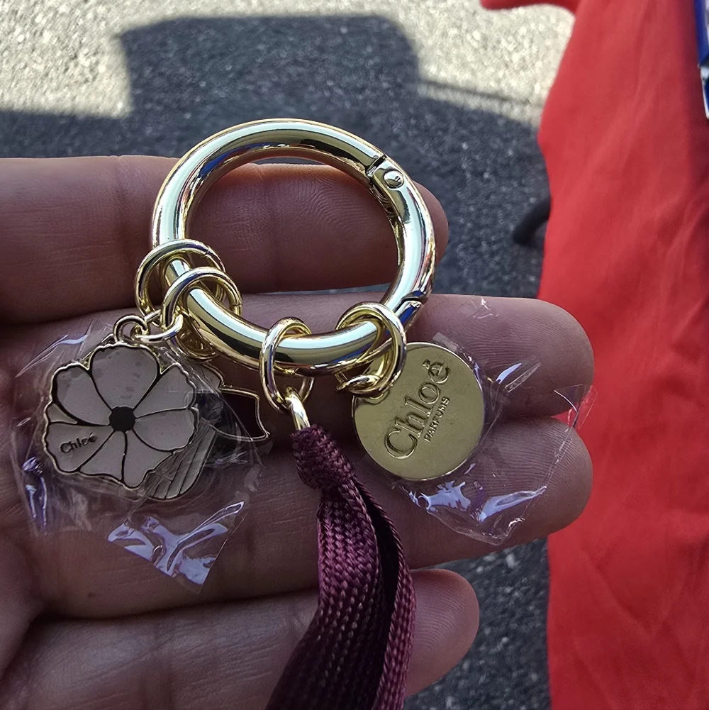 Chloe Gold-Tone Keyring with Burgundy Tassel & Flower Charm