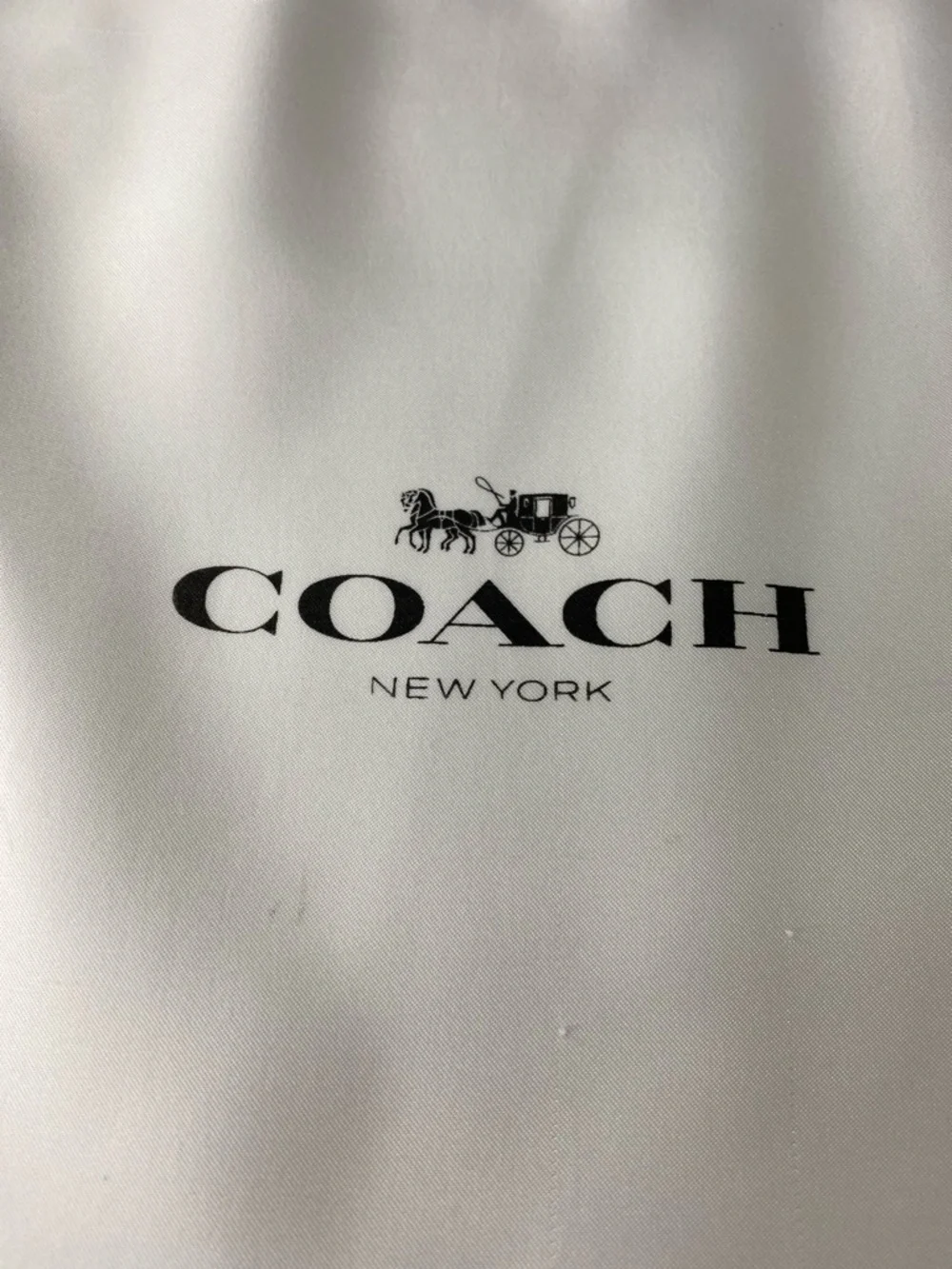 Coach branded white
