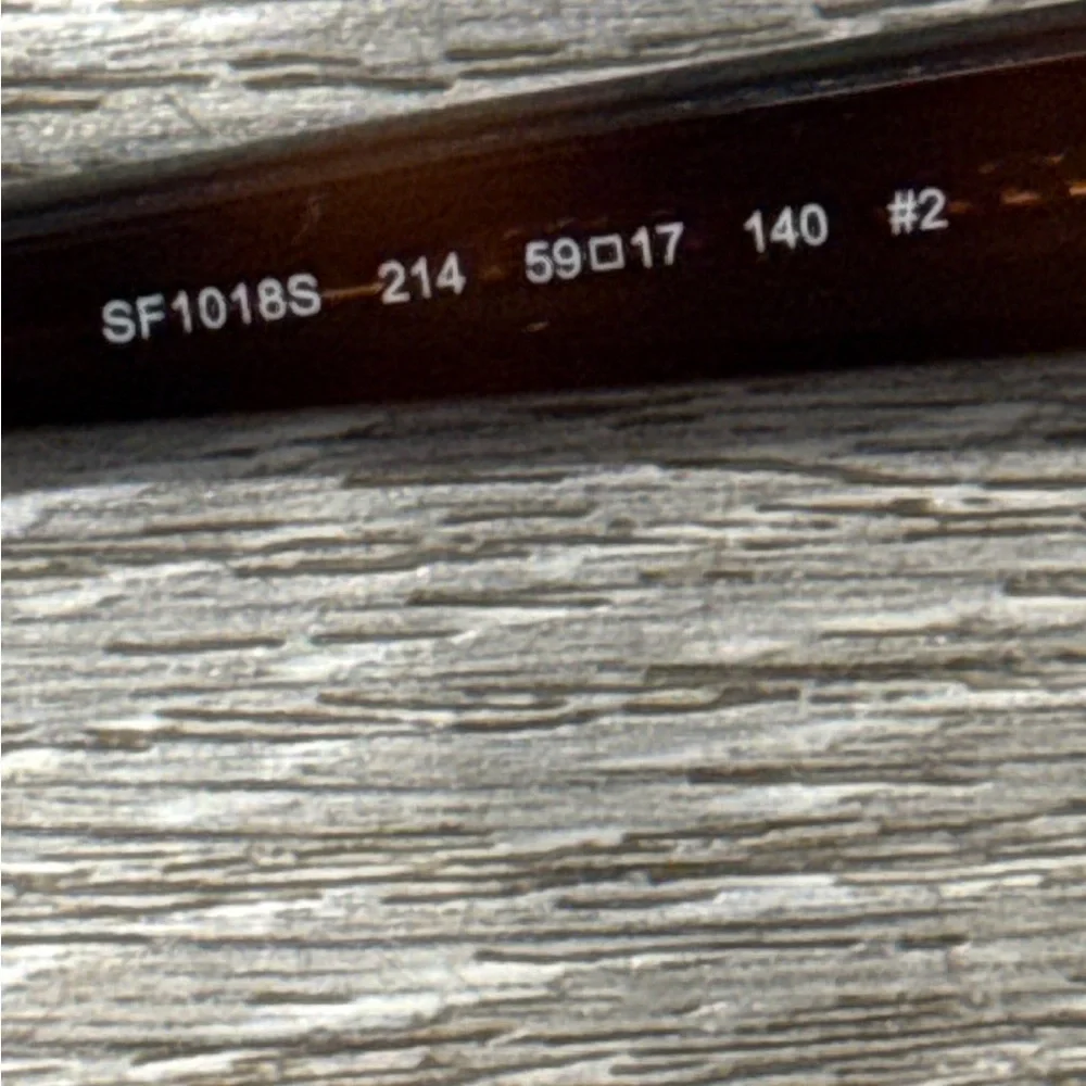 Salvatore Ferragamo Tortoise Sunglasses with SF Logo at Temples.