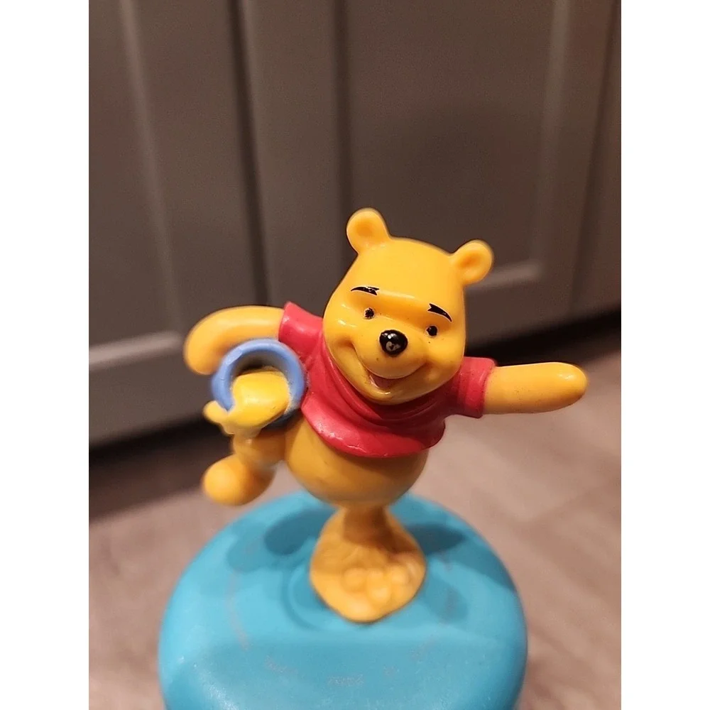 Winnie the pooh standing on one leg holding‎ honey pot plastic toy Cake Topper