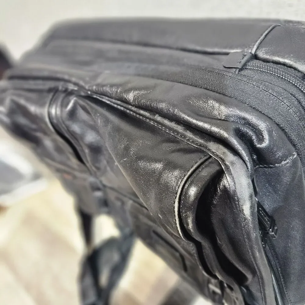 Tumi black leather