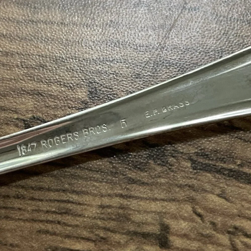 1847 Rogers Bros brass rmal