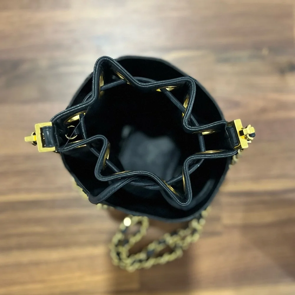 CHANEL Black Quilted Leather Drawstring Bucket Bag with Gold Hardware