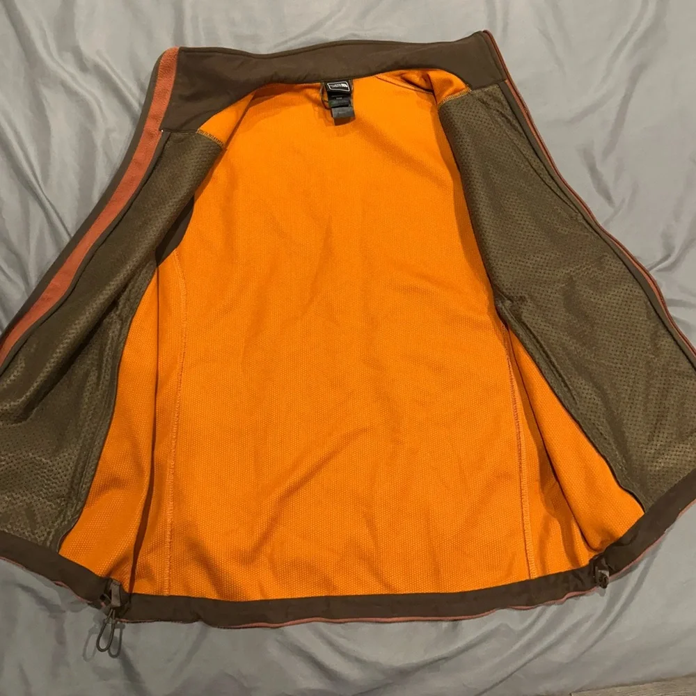 The North Face rust colored