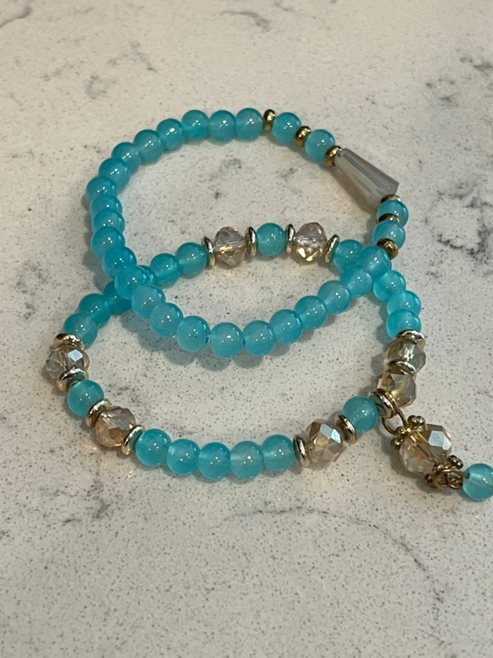 Set of 2 Blue gold tone stretchy bracelets