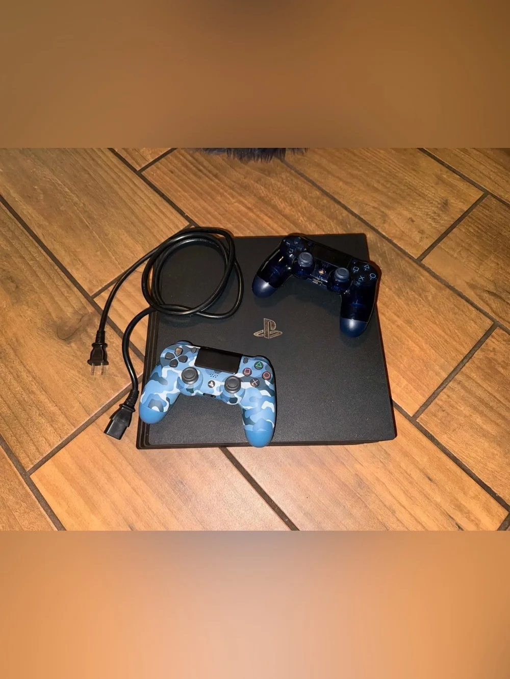 Sony PlayStation 4 console bundled with two DualShock 4 wireless controllers