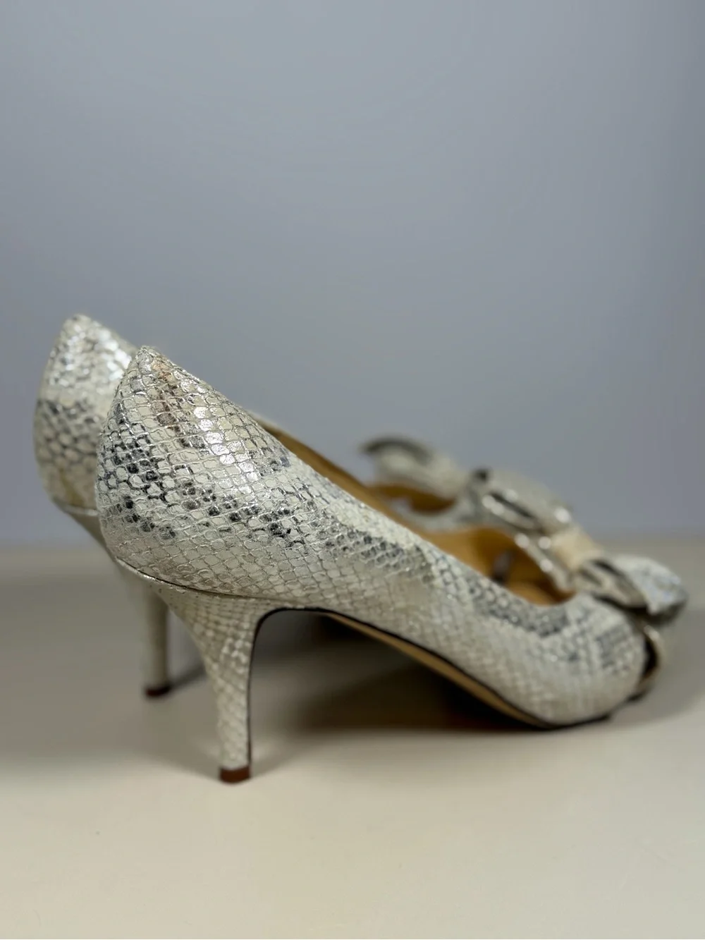 kate spade Silver Snake-Embossed Peep Toe Heels with Bow