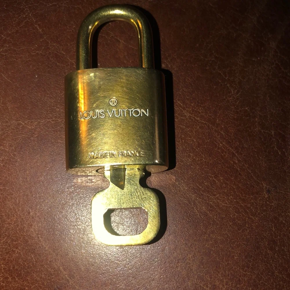 Louis Vuitton gold padlock and key set