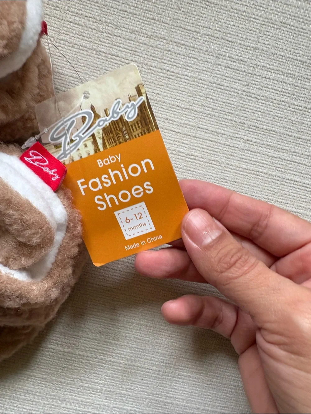 Cozy Plush Baby Booties in soft blush pink taupe