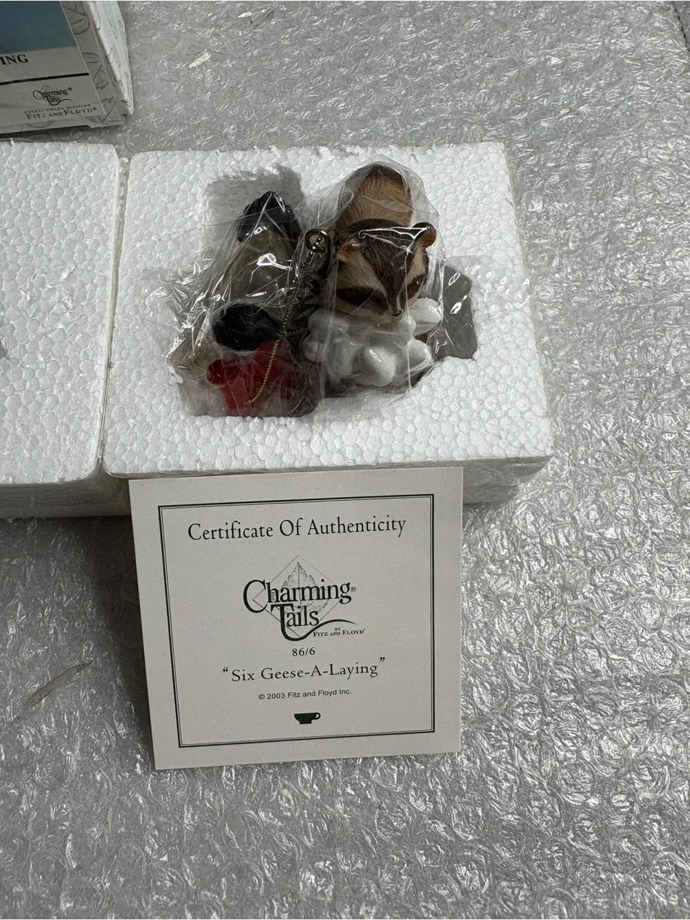 Fitz and Floyd Charming Tails ornament titled 