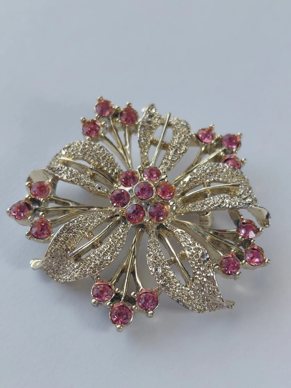 None this brooch