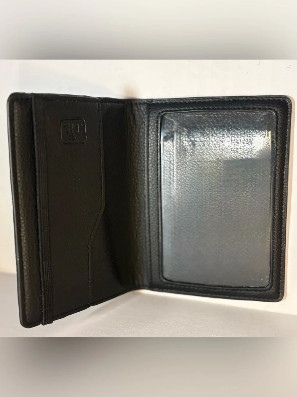 Open Story black pebble leather passport holder or travel wallet