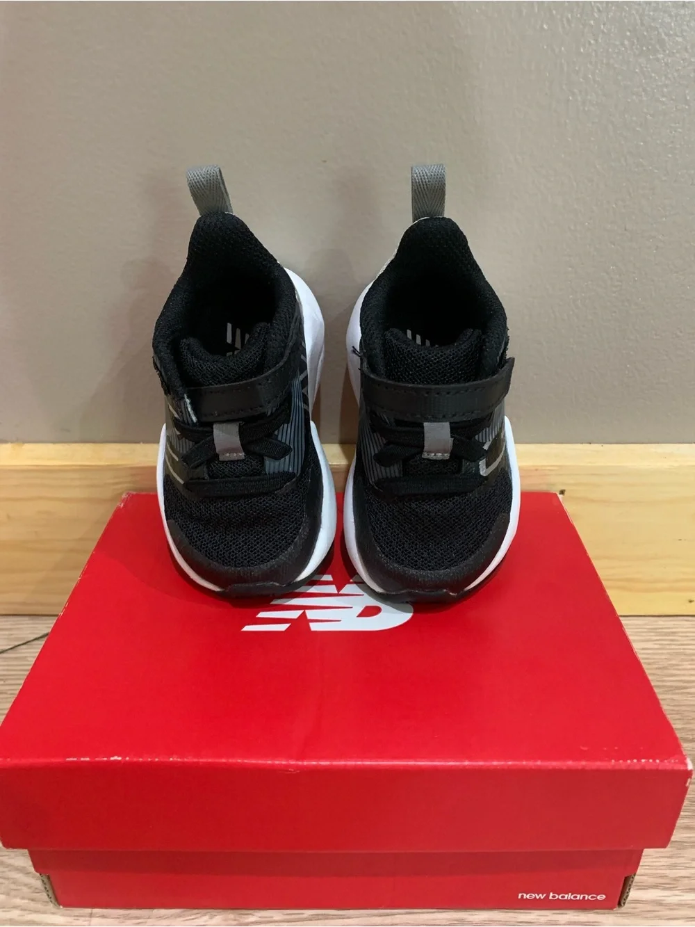 LIKE NEW New Balance baby Black and White Velcro Athletic Sneakers