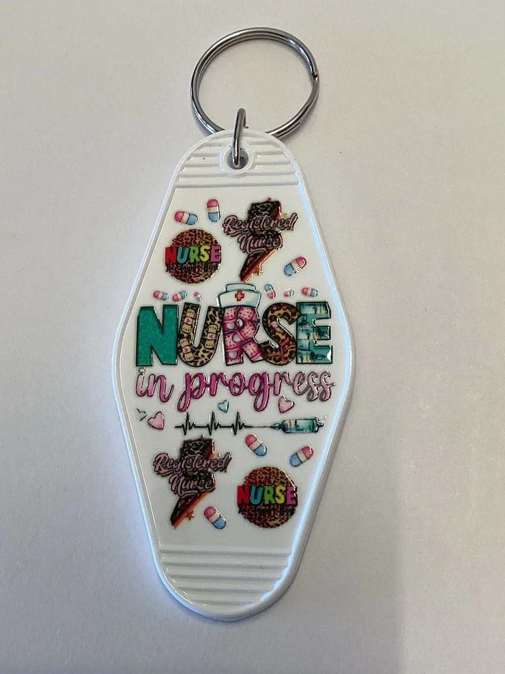 Nurse in Progress Keychain - White with Teal & Pink