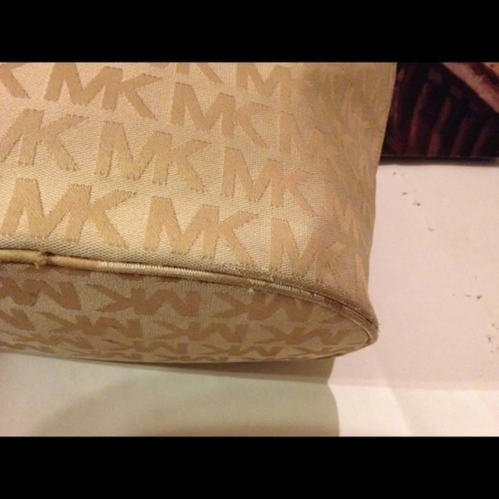Gold Michael Kors monogram tote
