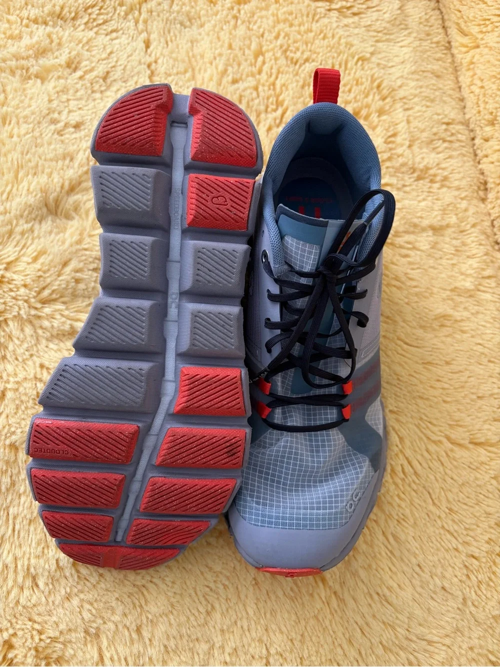 On Running Gray and Red Trail Runners
