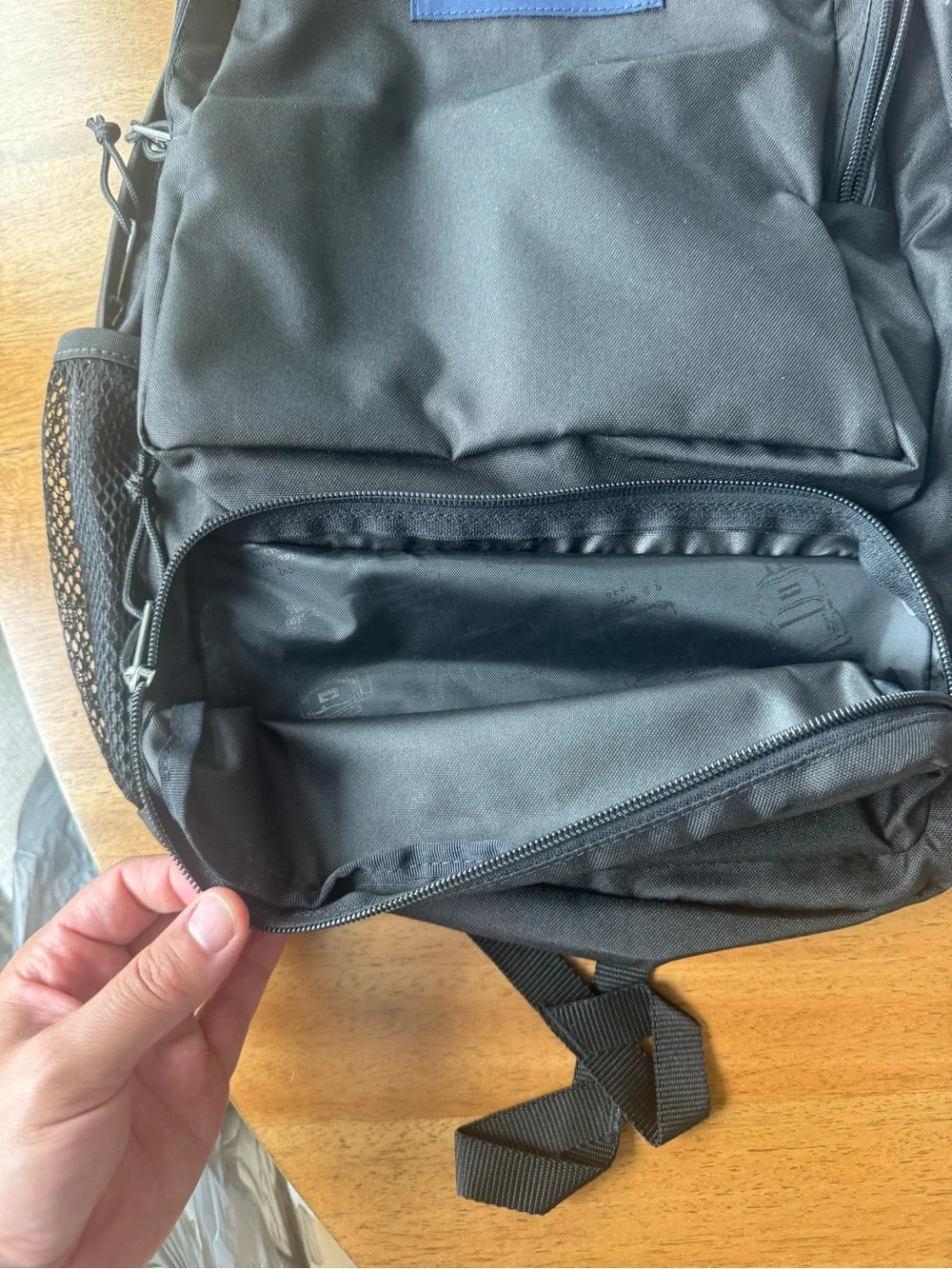 Jansport Black Backpack with Blue Logo Patch