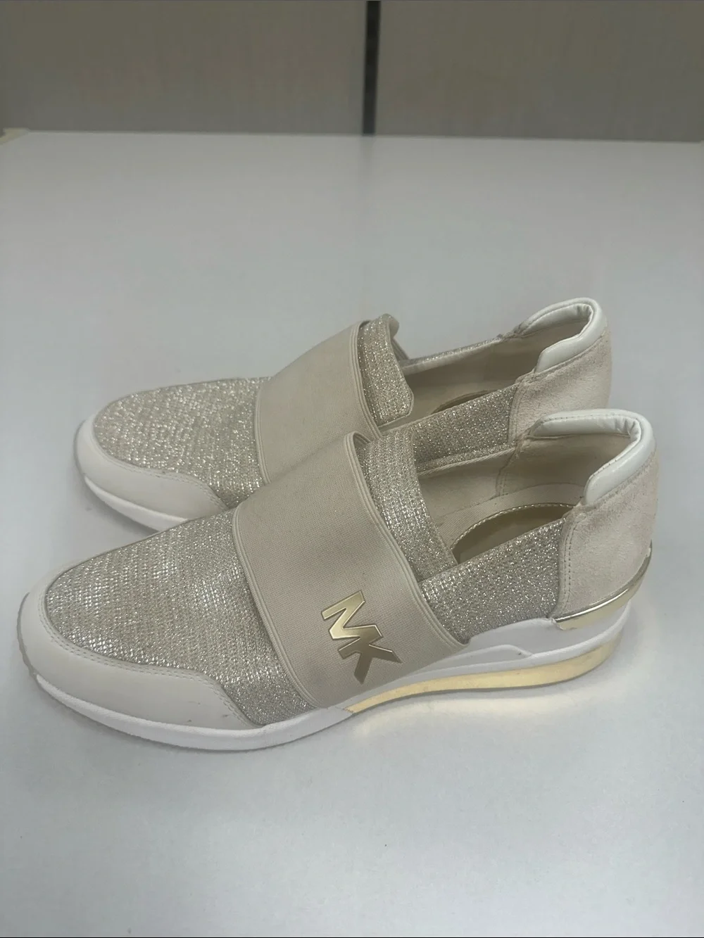 MICHAEL KORS Women’s Size 10 Felix wedge champagne gold slip on fashion sneakers