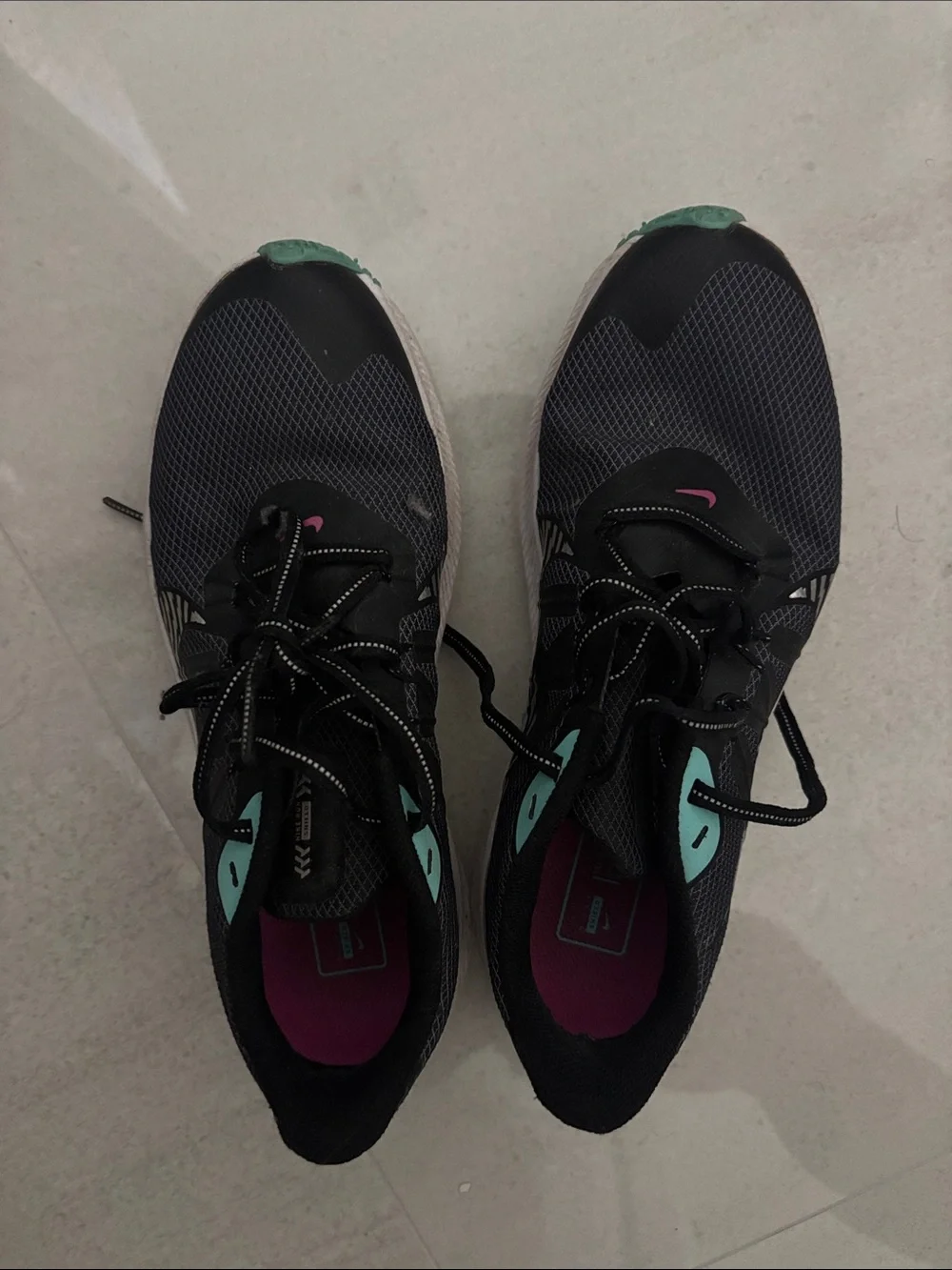 Nike Women's Black Running Shoes with Teal and Pink Accents