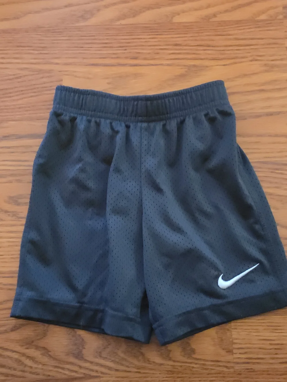 Nike Black Mesh Kids Athletic Shorts with White Swoosh