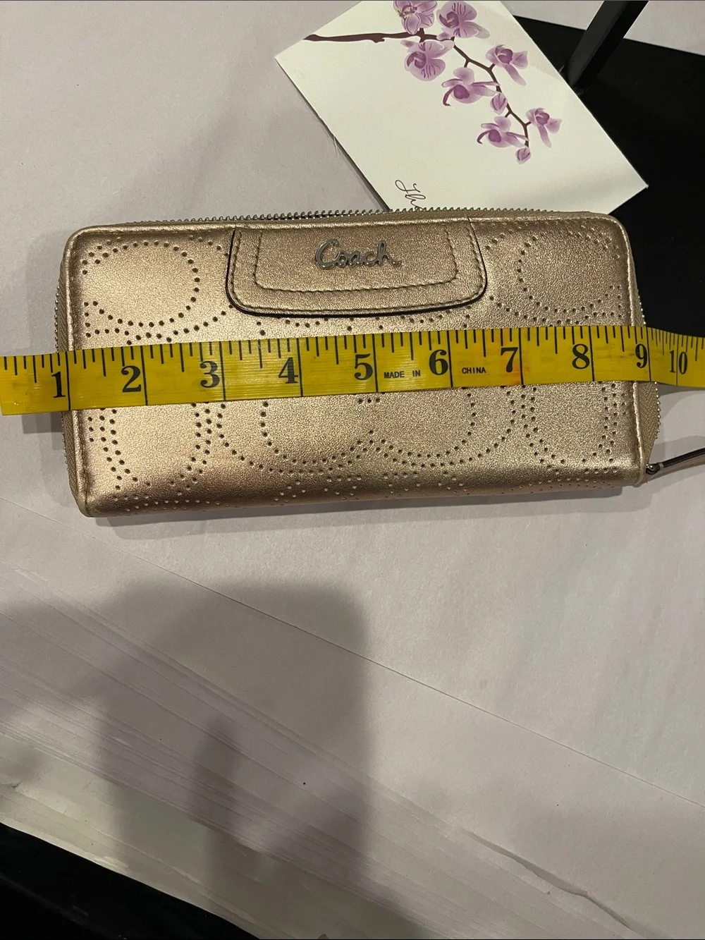 Coach Ashley perforated zip-around wallet.