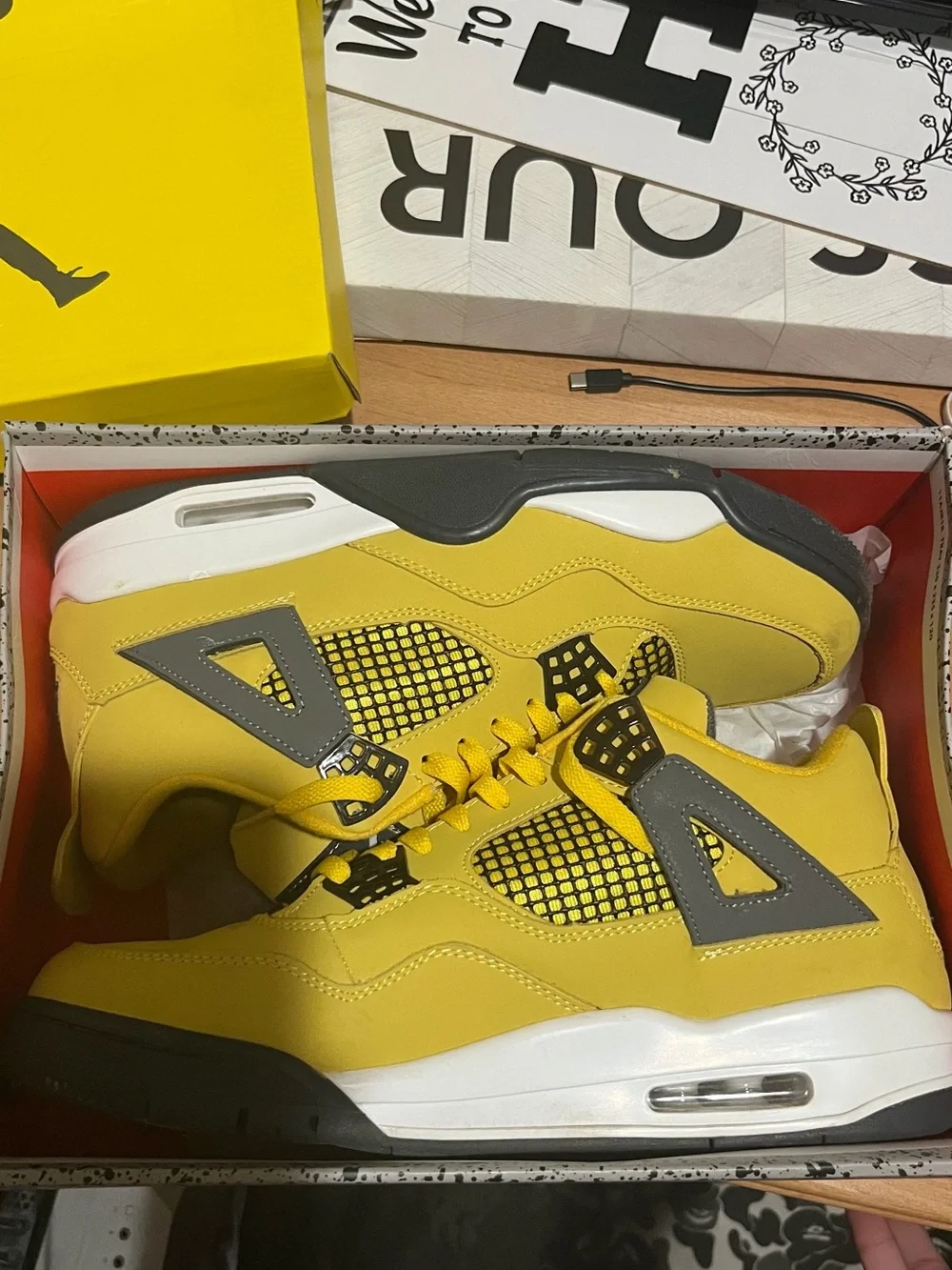 Yellow & gray Jordan Retro 4s