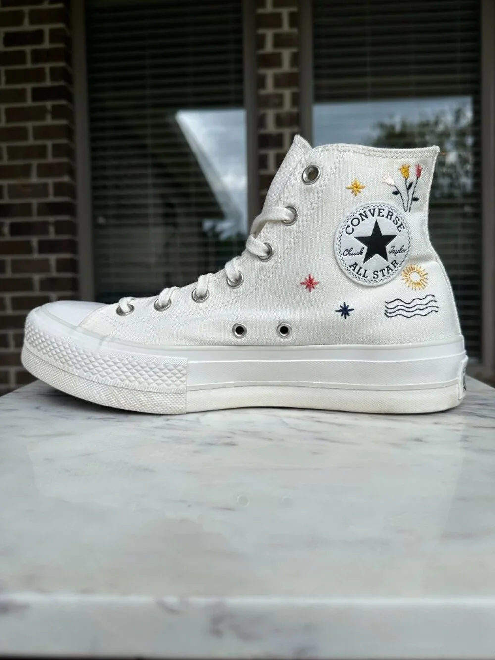 Converse scuffs visible