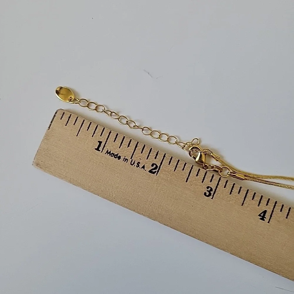 Neckglasses features gold