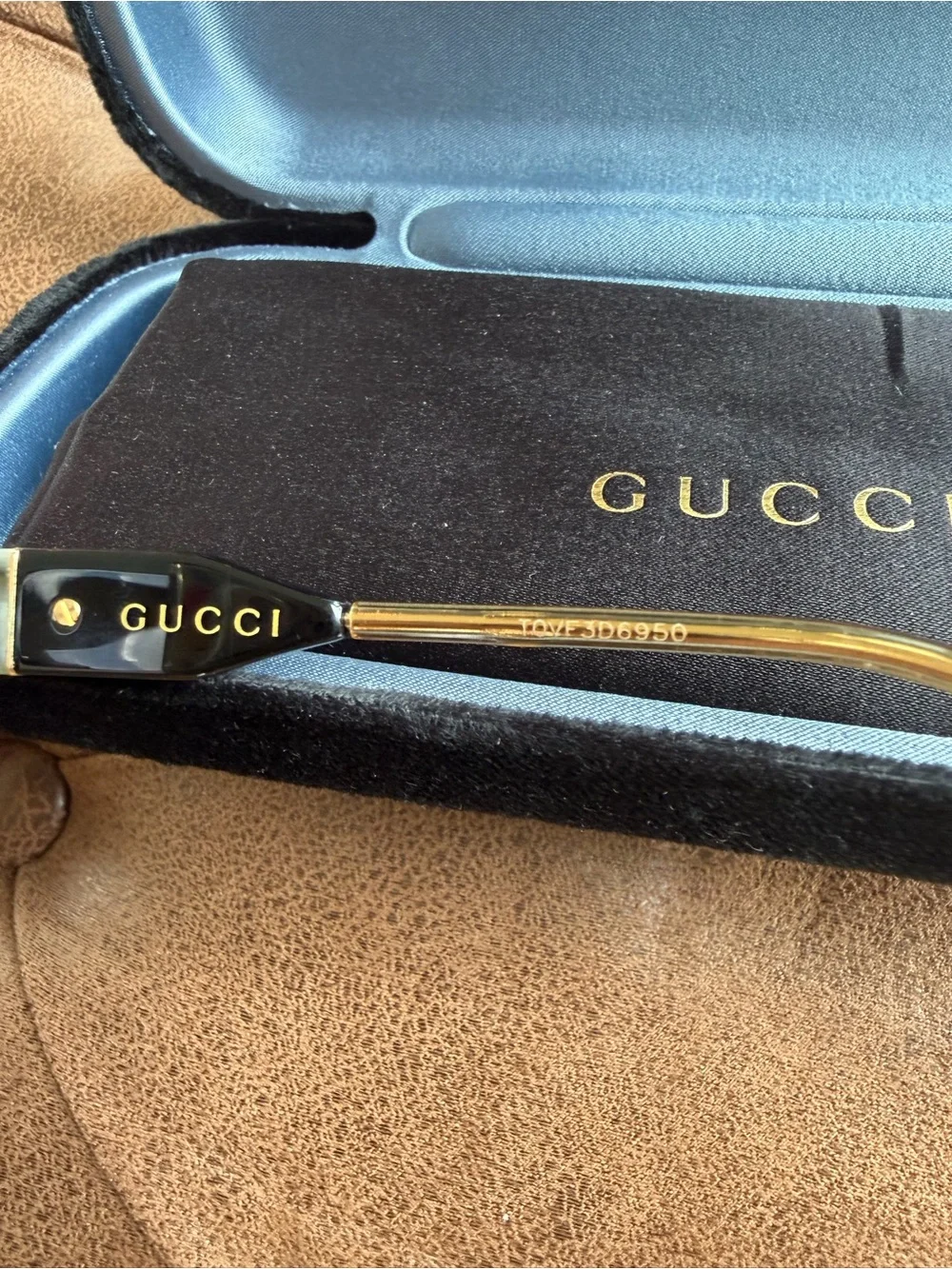 Gucci Black Frame Sunglasses with Amber Lenses