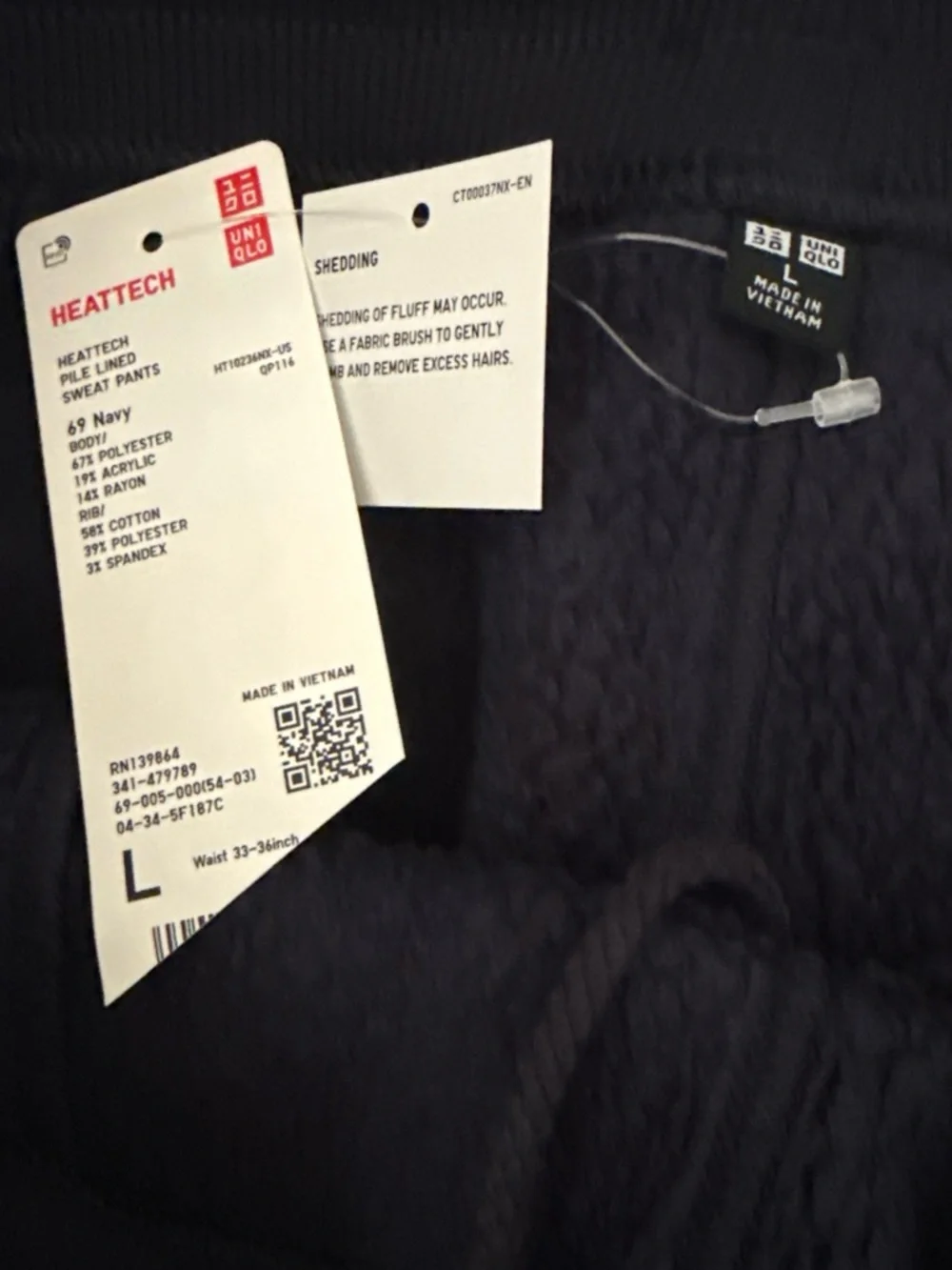 Navy blue UNIQLO Heattech pile lined sweatpants in size L. NWT