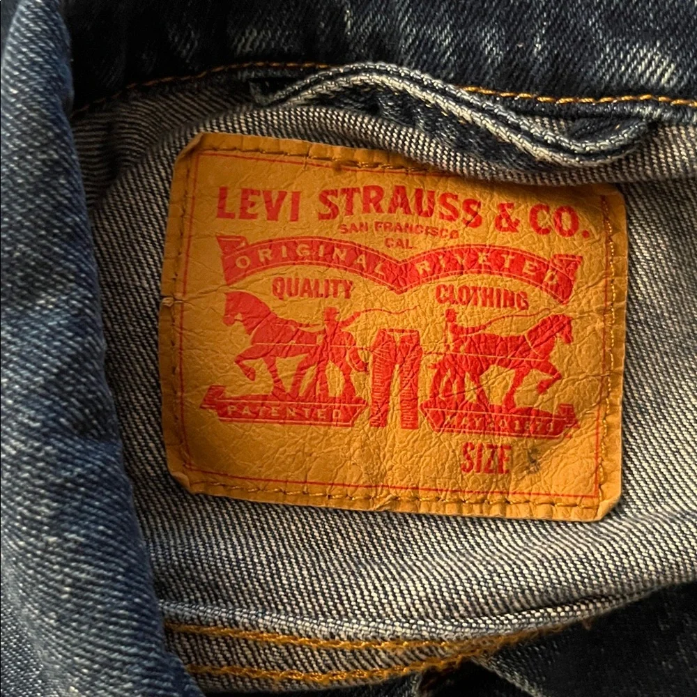 Levi's Trucker Jacket in a dark wash blue denim size S