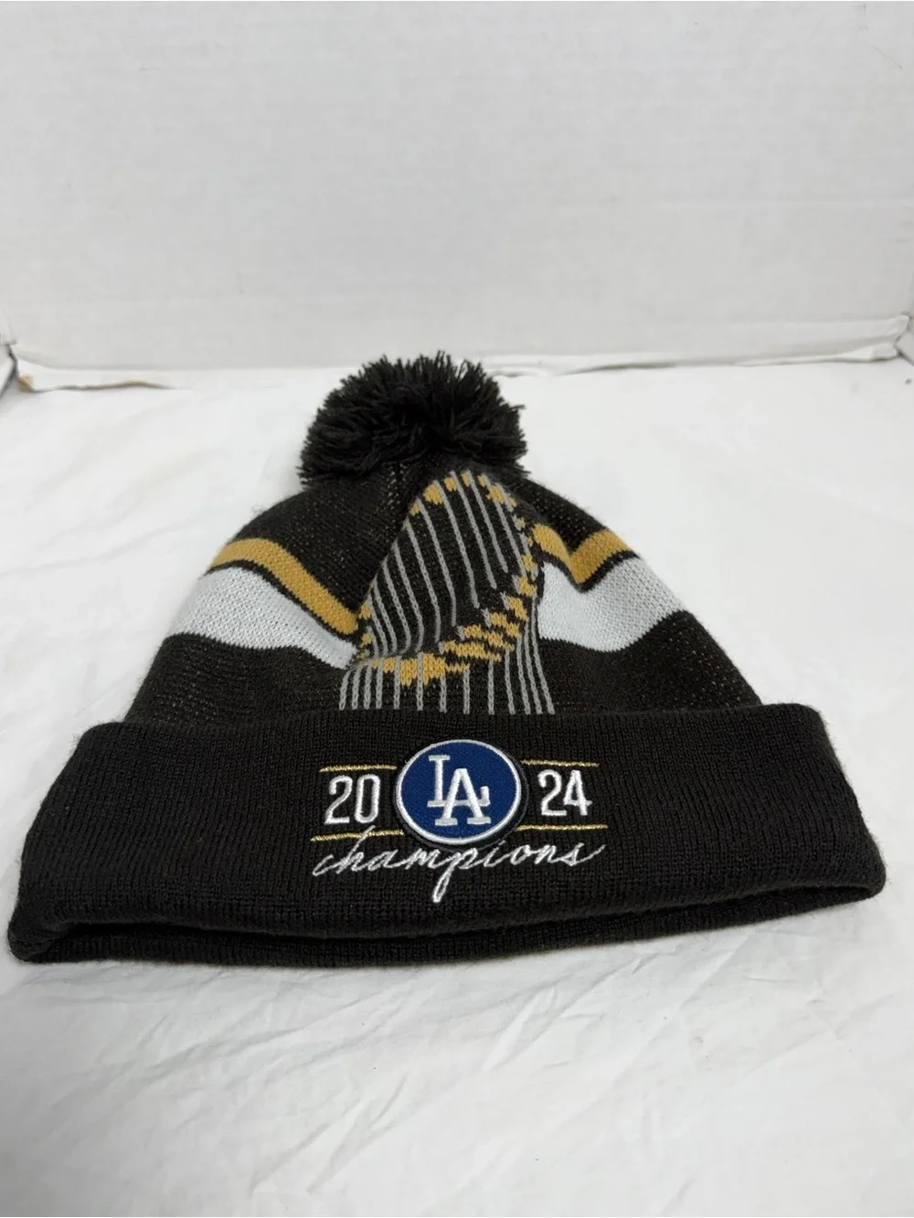 New Era Los Angeles Dodgers Black, White & Gold 2024 Champions Pom Beanie
