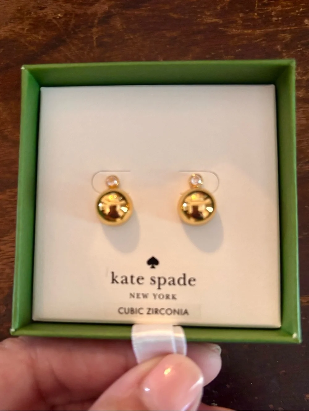 kate spade gold-tone item in lime green box