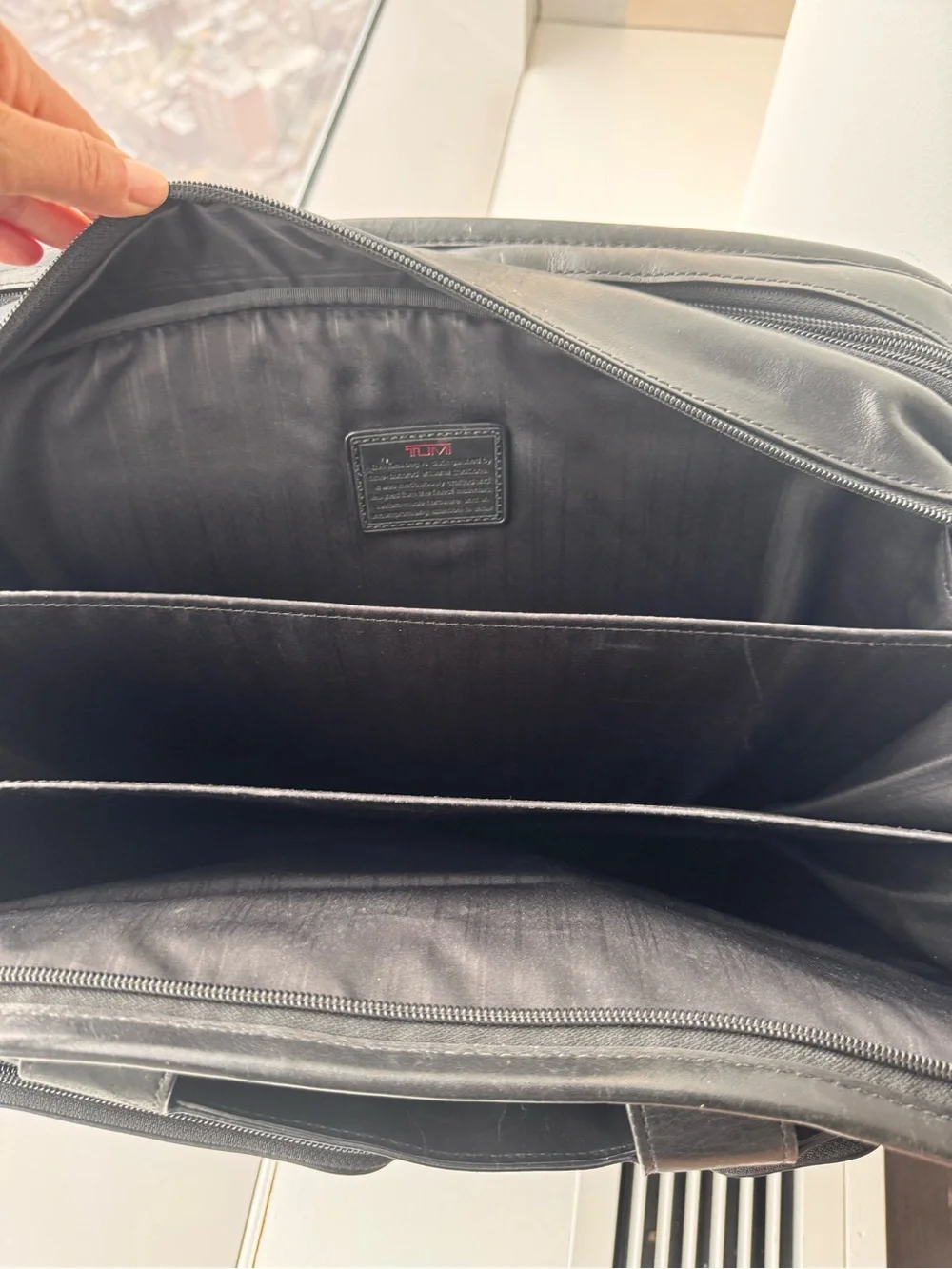 Tumi sleek black