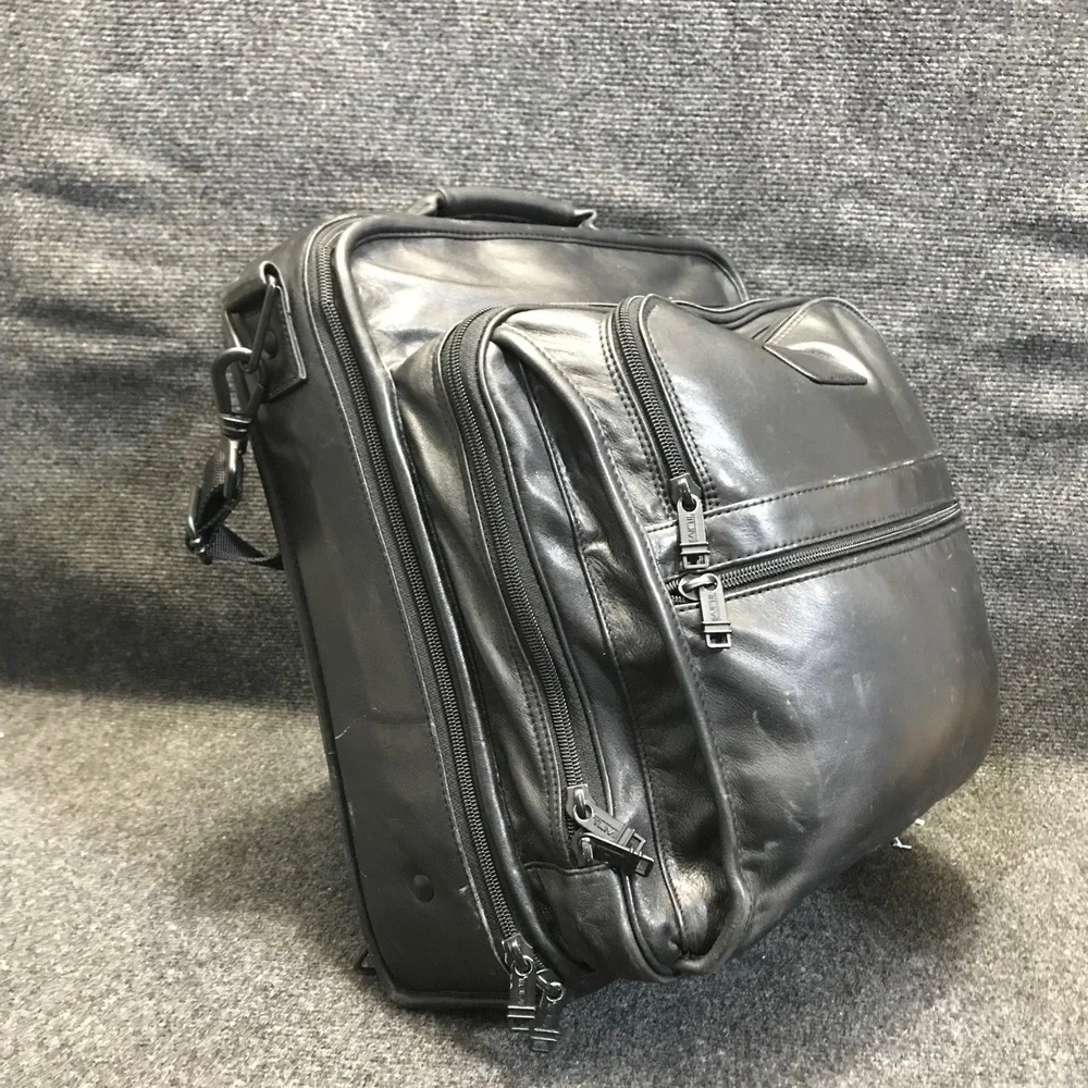 Tumi black leather