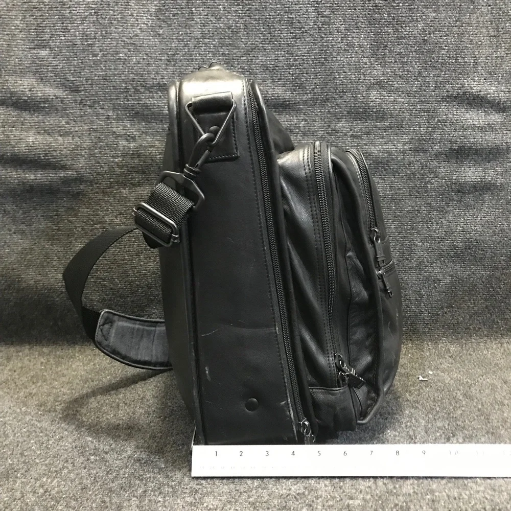 Tumi black leather