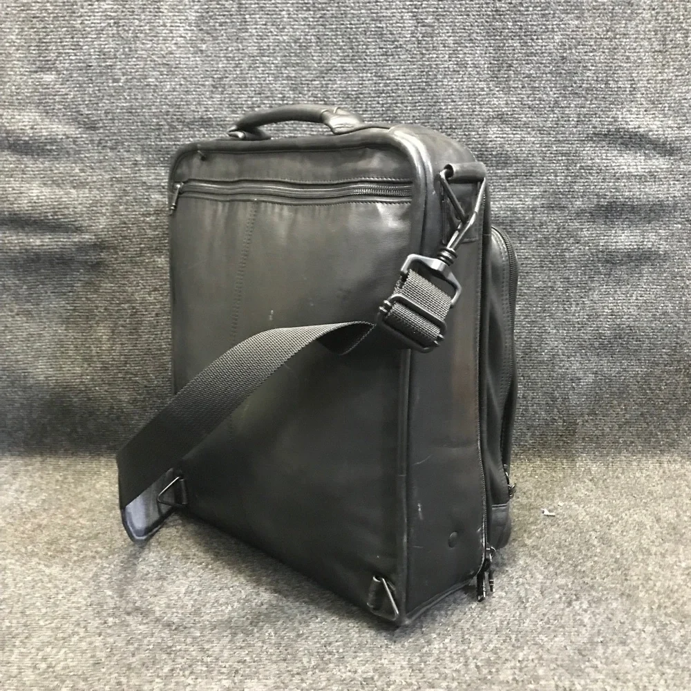 Tumi black leather